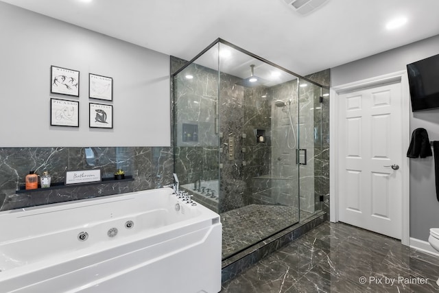 full bath featuring a jetted tub, marble finish floor, visible vents, and a stall shower