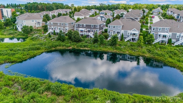 aerial view featuring a water view and a residential view