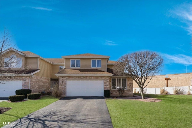 view of front facade featuring aphalt driveway, brick siding, a front yard, fence, and a garage