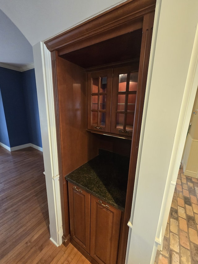 bar with light wood-type flooring and baseboards