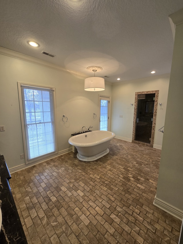 bathroom featuring baseboards and recessed lighting