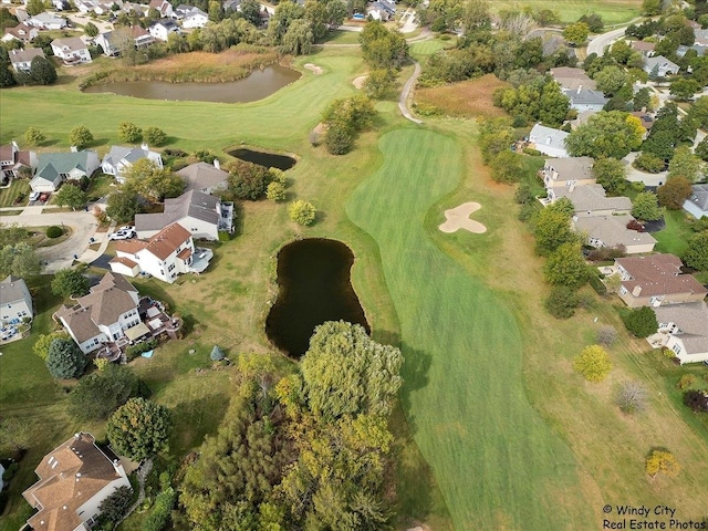 birds eye view of property with a residential view, a water view, and golf course view