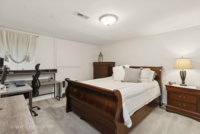 bedroom featuring light carpet and visible vents