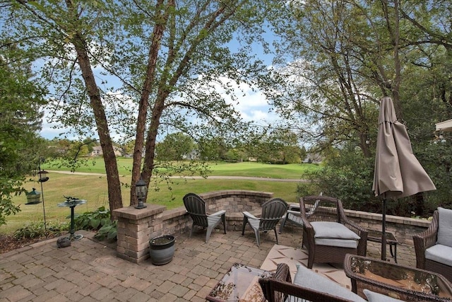 view of patio / terrace featuring an outdoor living space with a fire pit