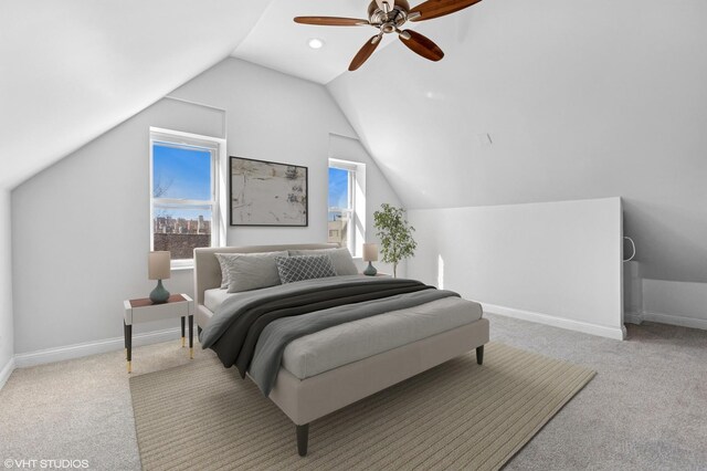 carpeted bedroom featuring baseboards, multiple windows, lofted ceiling, and ceiling fan