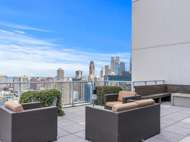 view of patio featuring a view of city and a balcony