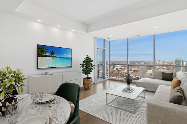 living room featuring recessed lighting, floor to ceiling windows, and wood finished floors