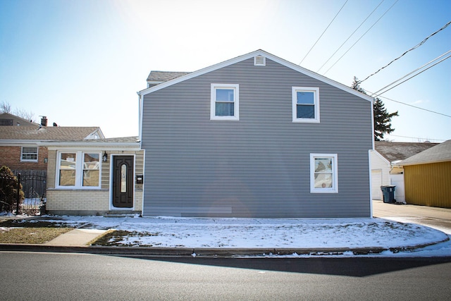 view of front of home with brick siding