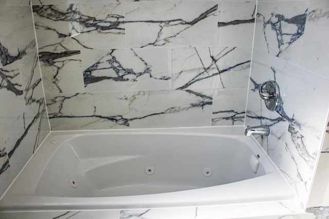 bathroom with a whirlpool tub