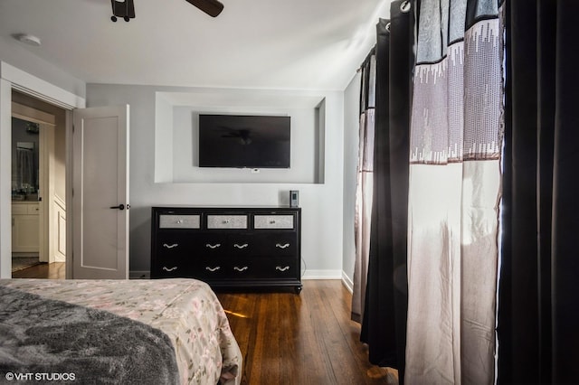 bedroom featuring ceiling fan, baseboards, and dark wood-type flooring