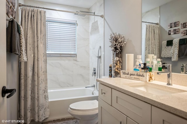 bathroom with vanity, shower / bath combo with shower curtain, and toilet