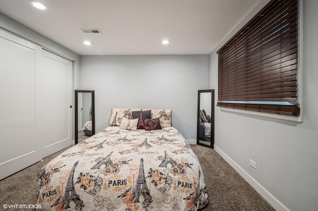 carpeted bedroom with recessed lighting, visible vents, and baseboards