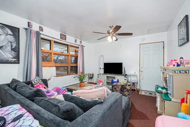 carpeted living area featuring ceiling fan