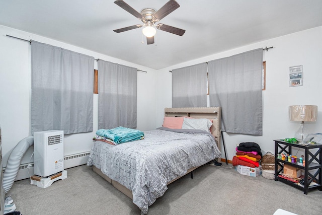 bedroom featuring carpet floors, a baseboard radiator, and ceiling fan