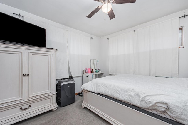 carpeted bedroom featuring a ceiling fan