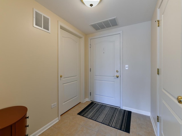 entryway featuring visible vents, baseboards, and light tile patterned floors