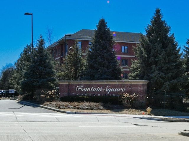 community sign with fence