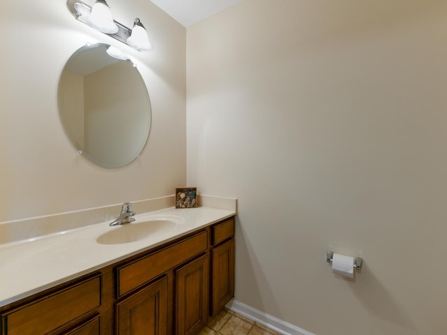 bathroom featuring baseboards and vanity