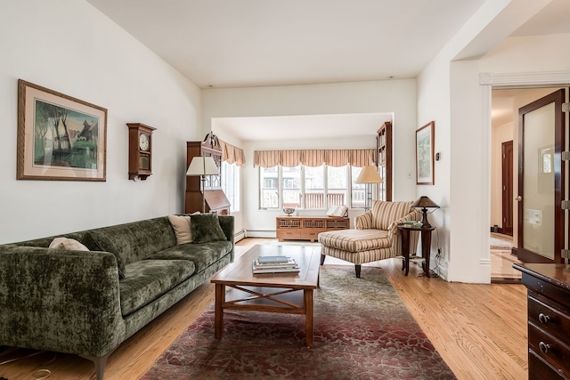 living room featuring light wood-type flooring and baseboard heating