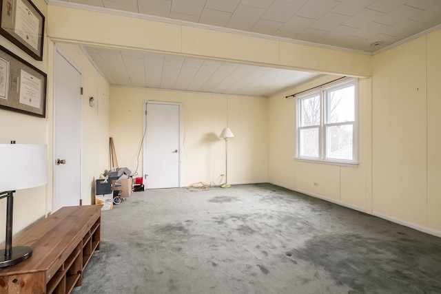 carpeted empty room with ornamental molding