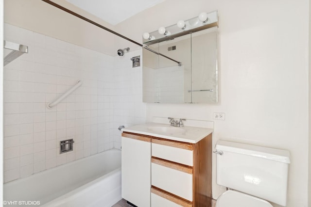 full bathroom with toilet, vanity, and shower / tub combination