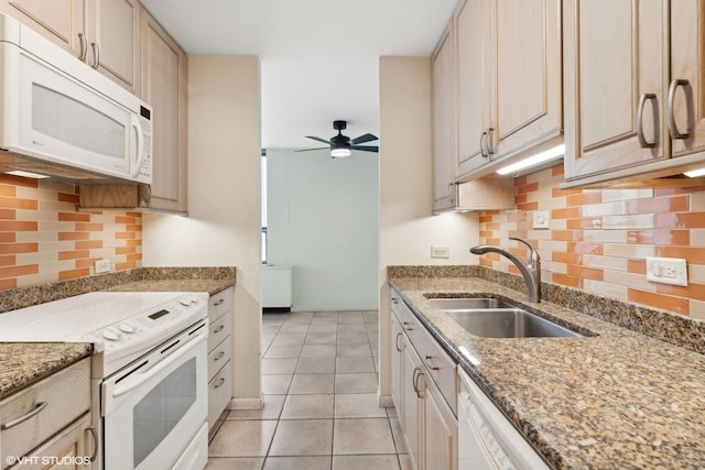 kitchen featuring light tile patterned floors, tasteful backsplash, a ceiling fan, a sink, and white appliances