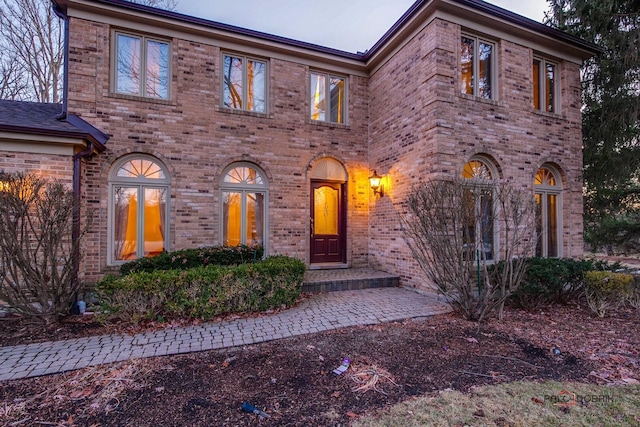 view of front of house with brick siding