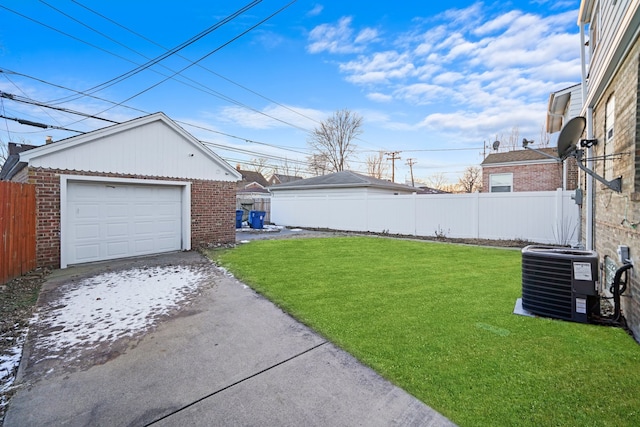 view of yard featuring an outbuilding, central air condition unit, a detached garage, fence, and driveway