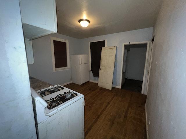 kitchen with dark wood-style floors and white appliances