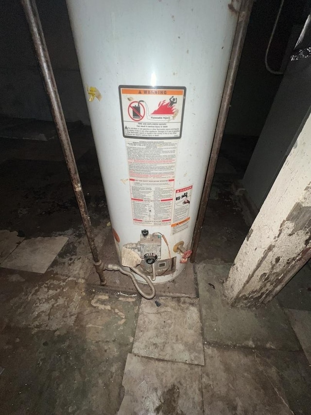 utility room featuring gas water heater