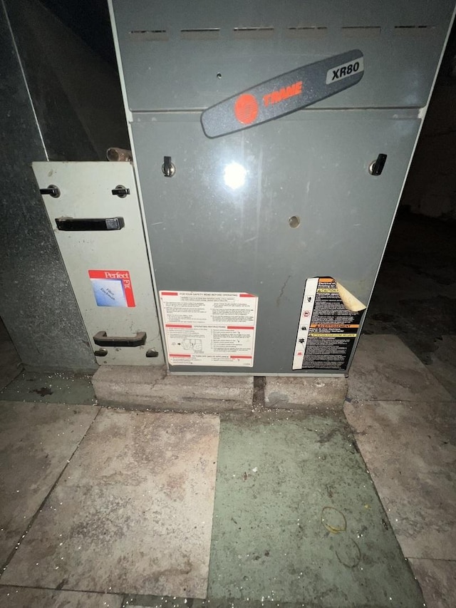 utility room with heating unit