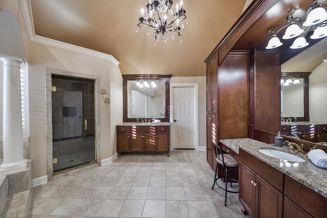 bathroom featuring two vanities, a sink, a shower stall, and ornate columns