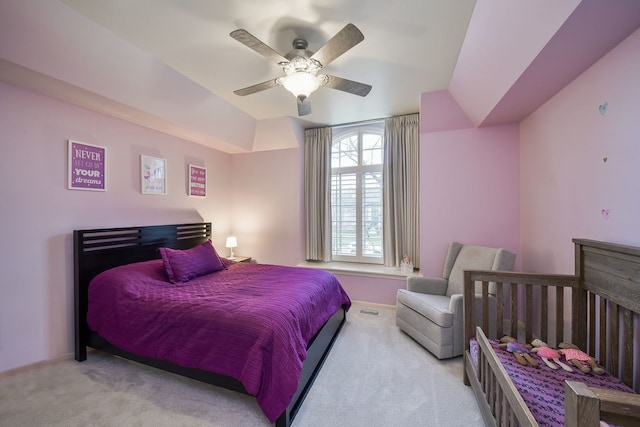 carpeted bedroom featuring ceiling fan and baseboards