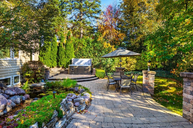 view of patio / terrace with outdoor dining space and a grill