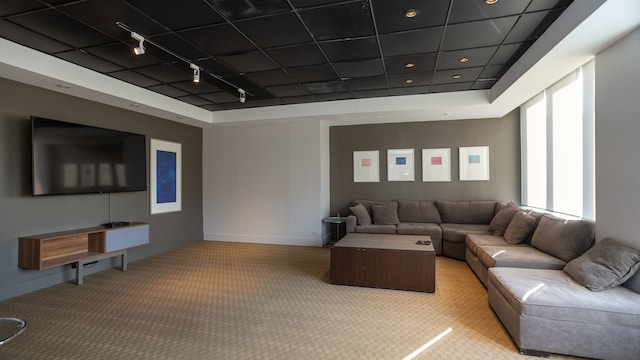 655 W Irving Park Rd Unit 909, Chicago, IL 60613 - carpeted living room with track lighting, baseboards, and a tray ceiling