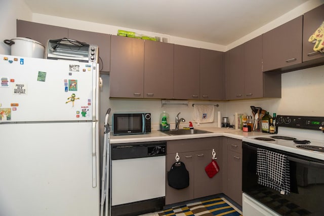 655 W Irving Park Rd Unit 909, Chicago, IL 60613 - kitchen with white appliances, a sink, light countertops, and gray cabinets