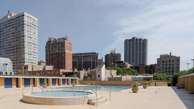 655 W Irving Park Rd Unit 909, Chicago, IL 60613 - community pool featuring a city view and a hot tub