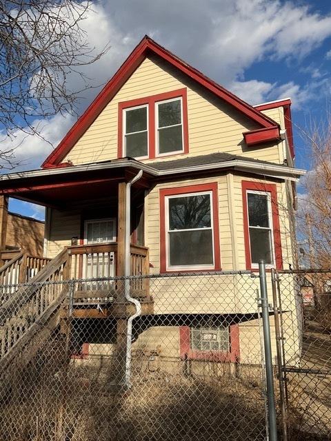 exterior space featuring covered porch and a fenced front yard