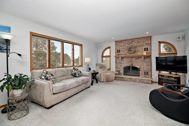 living room with carpet floors, recessed lighting, and a brick fireplace