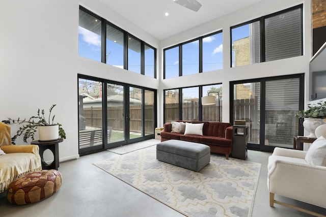 sunroom / solarium with french doors and a healthy amount of sunlight