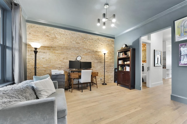 office with baseboards, brick wall, wood finished floors, and crown molding