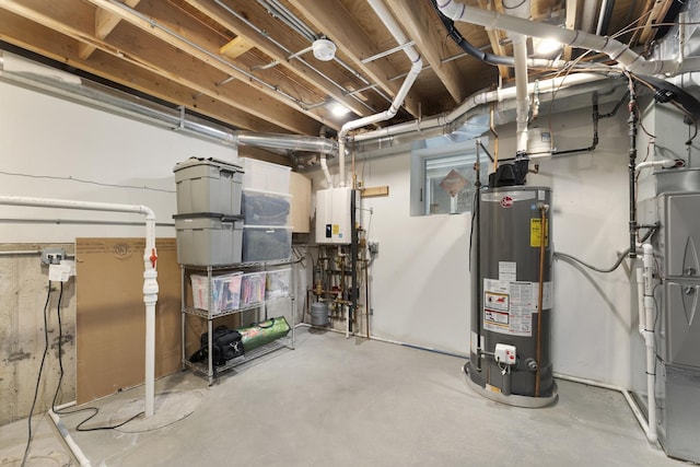 utility room featuring water heater and gas water heater