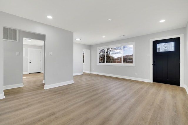 foyer entrance featuring recessed lighting, baseboards, visible vents, and light wood finished floors