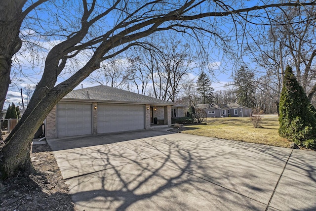 view of property exterior with a lawn, concrete driveway, roof with shingles, an attached garage, and brick siding