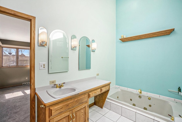 full bathroom featuring a jetted tub and vanity