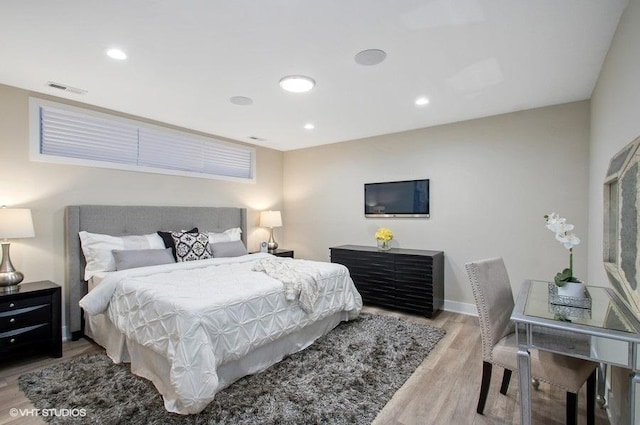 bedroom featuring recessed lighting, baseboards, and wood finished floors