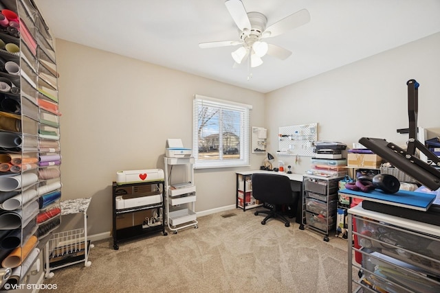 office area featuring ceiling fan, baseboards, and carpet floors