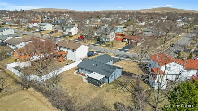 birds eye view of property with a residential view