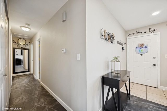 foyer entrance with baseboards