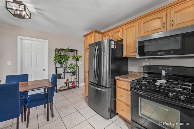 kitchen featuring light tile patterned floors and appliances with stainless steel finishes